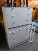 A WHITE PAINTED CHEVAL TOWEL RAIL AND A PAIR OF WHITE MELAMINE CHESTS OF THREE LONG DRAWERS, 2?8?