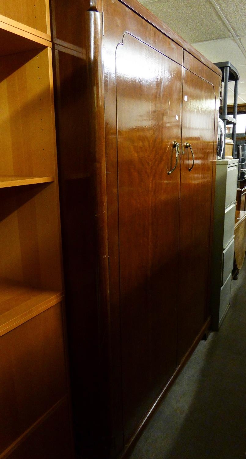 A LARGE MAHOGANY TWO DOOR SEMI-FITTED GENTS WARDROBE