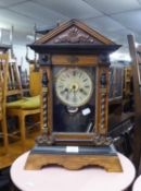 OAK SIMULATED CASED MANTEL CLOCK, HAVING DECORATIVE FRONT COLUMNS