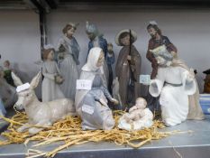 COLLECTION OF NAO FIGURES TO FORM THE CHRISTMAS NATIVITY, VIZ THE THREE KINGS, MARY, BABY JESUS,