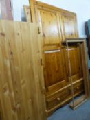 GOOD QUALITY PINE TWO DOOR WARDROBE HAVING DRAWER BASE WITH KNOB HANDLES AND SHAPED TOP