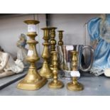 TWO PAIRS OF BRASS CANDLESTICKS, ANOTHER SMALLER PAIR, BRASS LION FACED DOOR KNOCKER, AND A