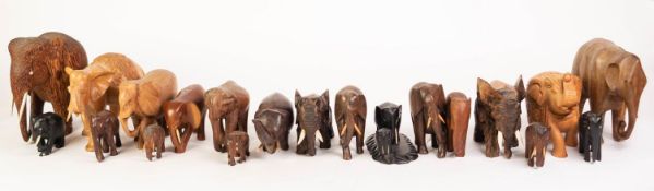 NINETEEN PRE-WAR AND LATER CARVED HARDWOOD FIGURES OF ELEPHANTS, including; three ebony examples,