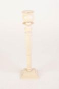 EARLY TWENTIETH CENTURY EUROPEAN CARVED IVORY CANDLESTICK, with vase shaped sconce, turned and