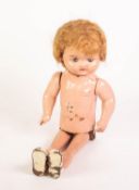 UNUSUAL PROBABLY ORE-WAR FLESH COLOURED TINPLATE AND MOULDED COMPOSITION TALL DOLL, the tinplate