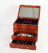 A MAHOGANY JEWELLERY CHEST with lift up top with interior mirror enclosing a filled interior, the