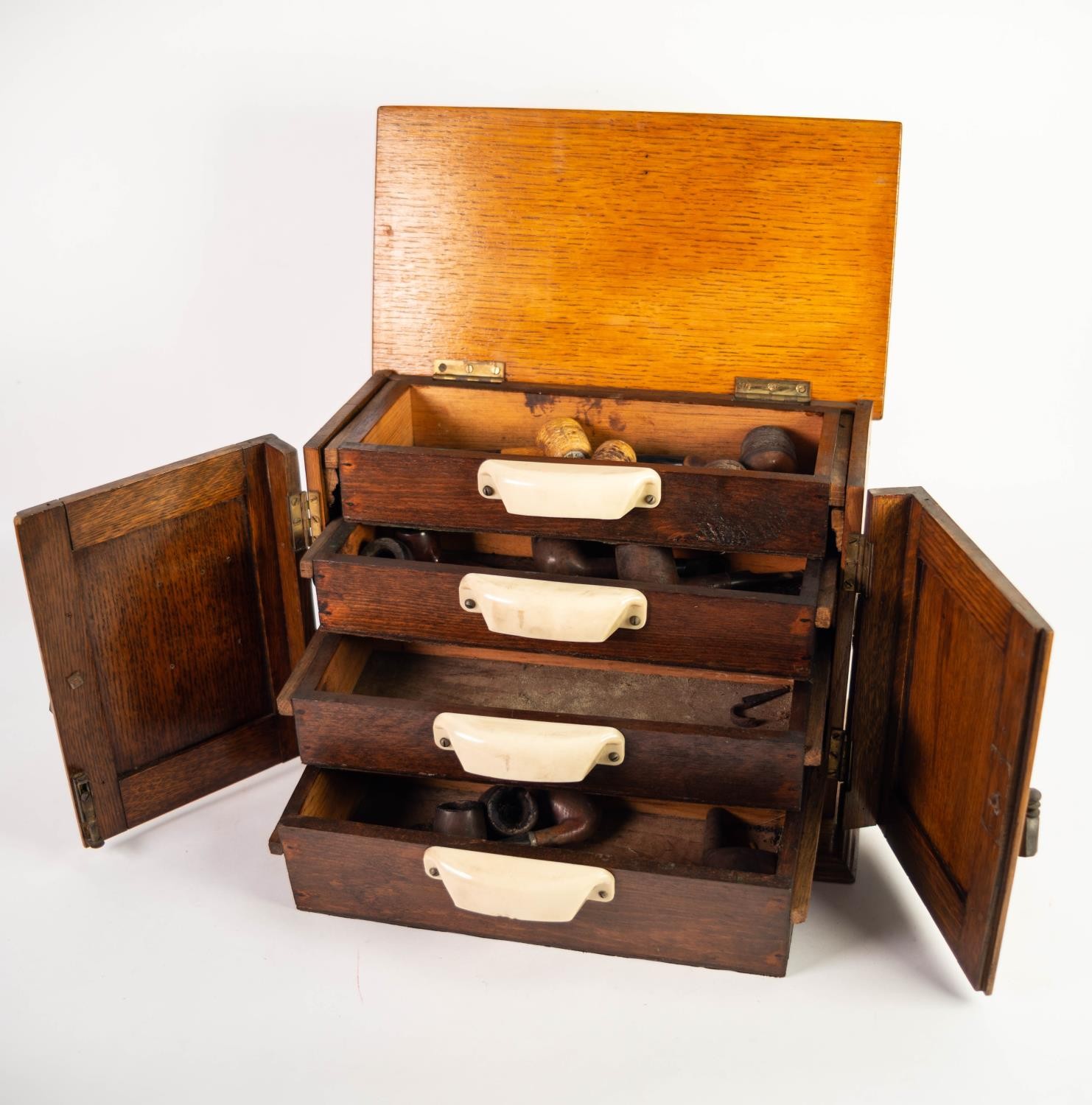 CIRCA 1920s CARVED OAK TWO DOOR SMOKER'S CABINET with hinge opening top, later fitted with four - Image 2 of 2