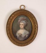 FRENCH SCHOOL (Late Nineteenth Century) OVAL PASTICHE PORTRAIT MINIATURE ON IVORY of a lady in