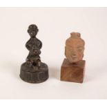 SMALL 19th CENTURY, PROBABLY INDIAN, BRONZE FIGURE OF A SEATED MAN HOLDING AN INCENSE BURNER