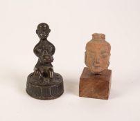 SMALL 19th CENTURY, PROBABLY INDIAN, BRONZE FIGURE OF A SEATED MAN HOLDING AN INCENSE BURNER