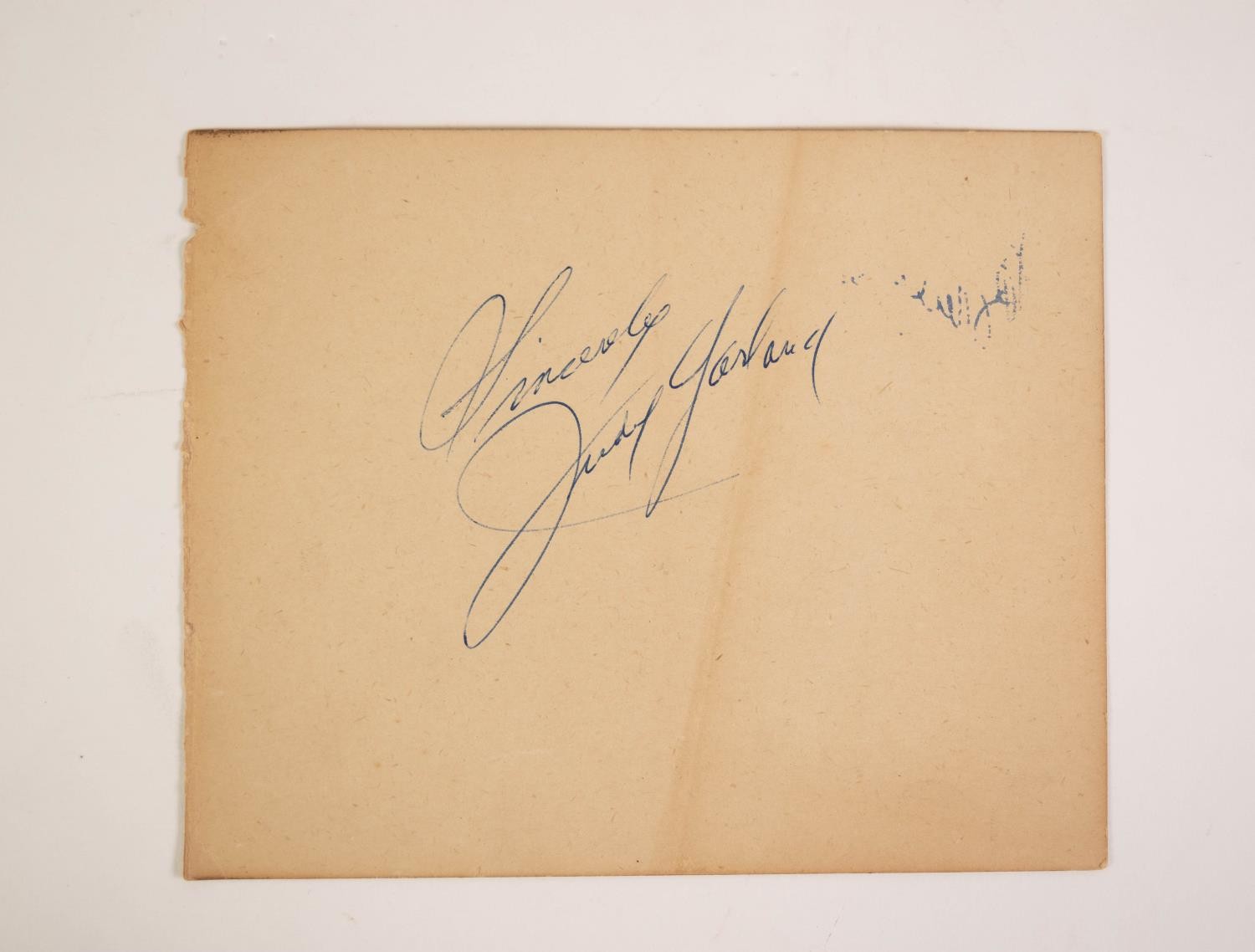 JUDY GARLAND AUTOGRAPH, on a page from an autograph book, ?Sincerely Judy Garland, 5? x 6? (12.7cm x