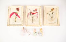 FOUR GERMAN PORCELAIN PIN CUSHION HEADS AND LEGS, also three 1950'S framed printed and applique work
