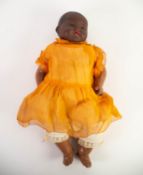 ARMAND MARSEILLE BISQUE HEADED BLACK BABY DOLL with brown glass eyes, open mouth and two lower