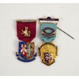 A SILVER GILT AND ENAMELLED BADGE AND RIBBON FOR THE ROYAL MASONIC INSTITUTION FOR BOYS, (RMBI ?