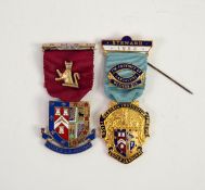 A SILVER GILT AND ENAMELLED BADGE AND RIBBON FOR THE ROYAL MASONIC INSTITUTION FOR BOYS, (RMBI ?