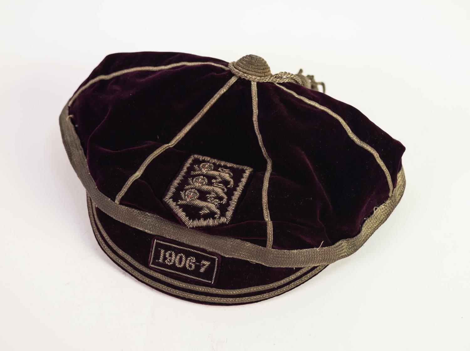 ENGLAND INTERNATIONAL FOOTBALL CAP 1906-7, deep purple velvet with silver braid and tassel with