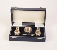 BOXED THREE PIECE POST-WAR HALLMARKED SILVER CONDIMENT SET AND SPOON, of pear shape, the mustard pot