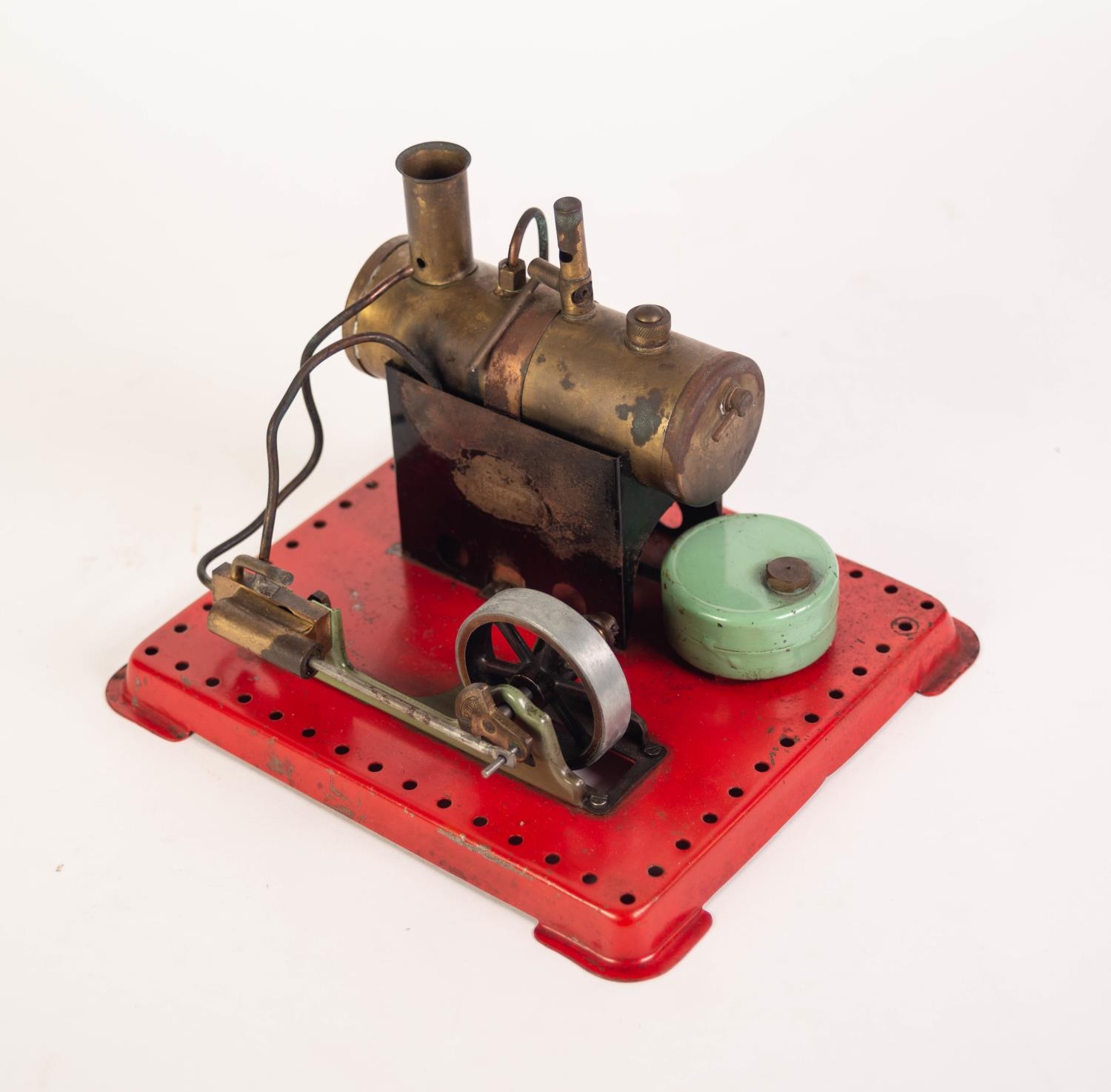 CIRCA 1950's MAMOD STATIONERY STEAM ENGINE, single piston driving a six spoke pulley wheel on red