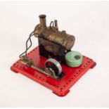 CIRCA 1950's MAMOD STATIONERY STEAM ENGINE, single piston driving a six spoke pulley wheel on red