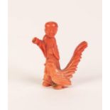 VERY SMALL 19th CENTURY CHINESE CARVED ORANGE BRANCH CORAL STANDING FIGURE OF MAN, right arm