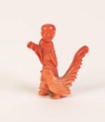 VERY SMALL 19th CENTURY CHINESE CARVED ORANGE BRANCH CORAL STANDING FIGURE OF MAN, right arm