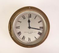 DAVEY AND CO., LONDON LTD. SMALL BRASS CASED BULKHEAD CLOCK, silvered dial with Roman numerals,