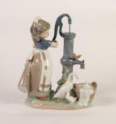 LLADRO PORCELAIN FIGURE, modelled as a young girl with duck and ducklings at a water pump, (5285), 9