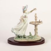 SIGNED LLADRO PORCELAIN FIGURE, modelled as a young girl beside a fountain, (6106), 10 ½? (26.7cm)