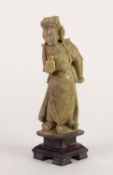 CHINESE WELL CARVED PALE GREEN SOAPSTONE FIGURE OF AN EMPEROR, modelled standing, wearing