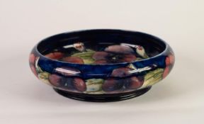 WALTER MOORCROFT PANSY PATTERN TUBE LINED POTTERY FRUIT BOWL, of shallow, footed form, painted in