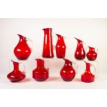 COLLECTION OF NINE WHITEFRIARS RED GLASS JUGS WITH CLEAR GLASS HANDLES, various shapes, 10 ¾? (27.