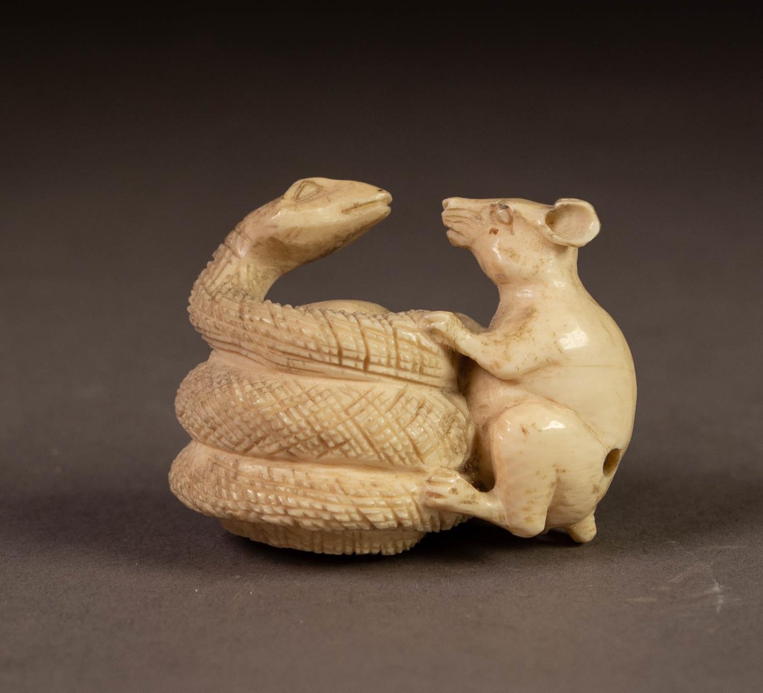 JAPANESE MEIJI PERIOD CARVED IVORY NETSUKE OF A RAT AND COBRA, 1 3/8? (3.4cm) high, two character