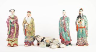 FIVE 20th CENTURY CHINESE PORCELAIN STANDING AND RECUMBENT MALE AND FEMALE DEITY FIGURES, each