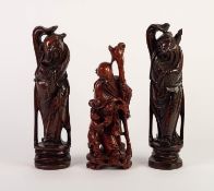 NEAR MATCHING PAIR OF CHINESE CARVED REDWOOD AND SILVER WIRE INLAID FIGURES, each modelled as a