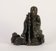 CHINESE CARVED MOTTLED GREEN SOAPSTONE GROUP, modelled as a sage standing with a family of goats