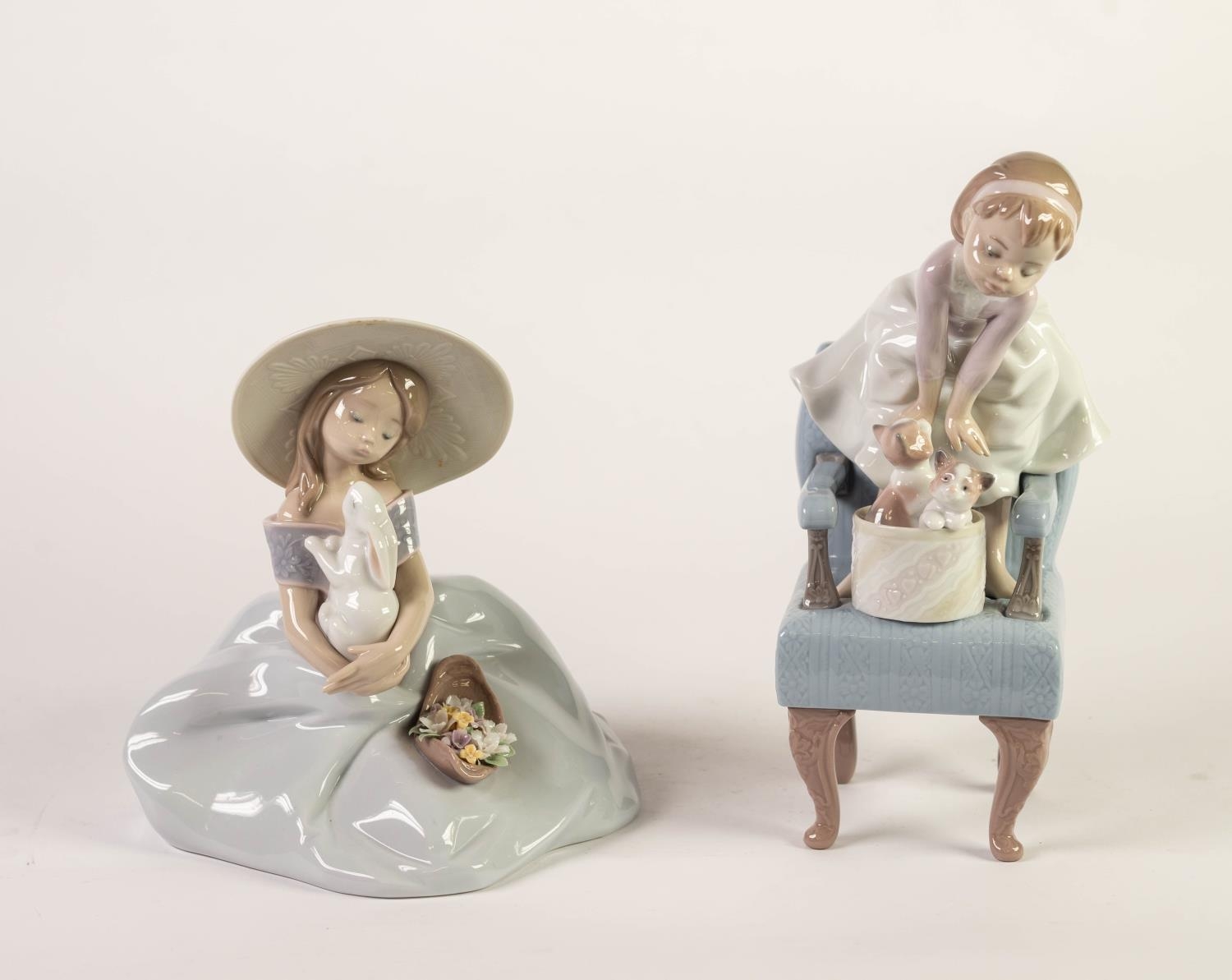TWO LLADRO PORCELAIN GROUP OF YOUNG GIRLS WITH SMALL PET ANIMALS, one modelled standing on a chair