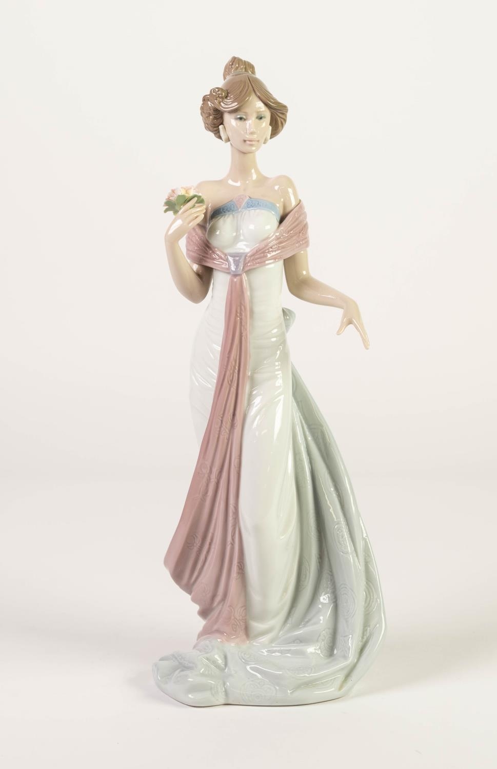 LLADRO PORCELAIN MODEL OF AN ELEGANT FEMALE FIGURE with flower spray in his right hand, model number