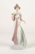 LLADRO PORCELAIN MODEL OF AN ELEGANT FEMALE FIGURE with flower spray in his right hand, model number