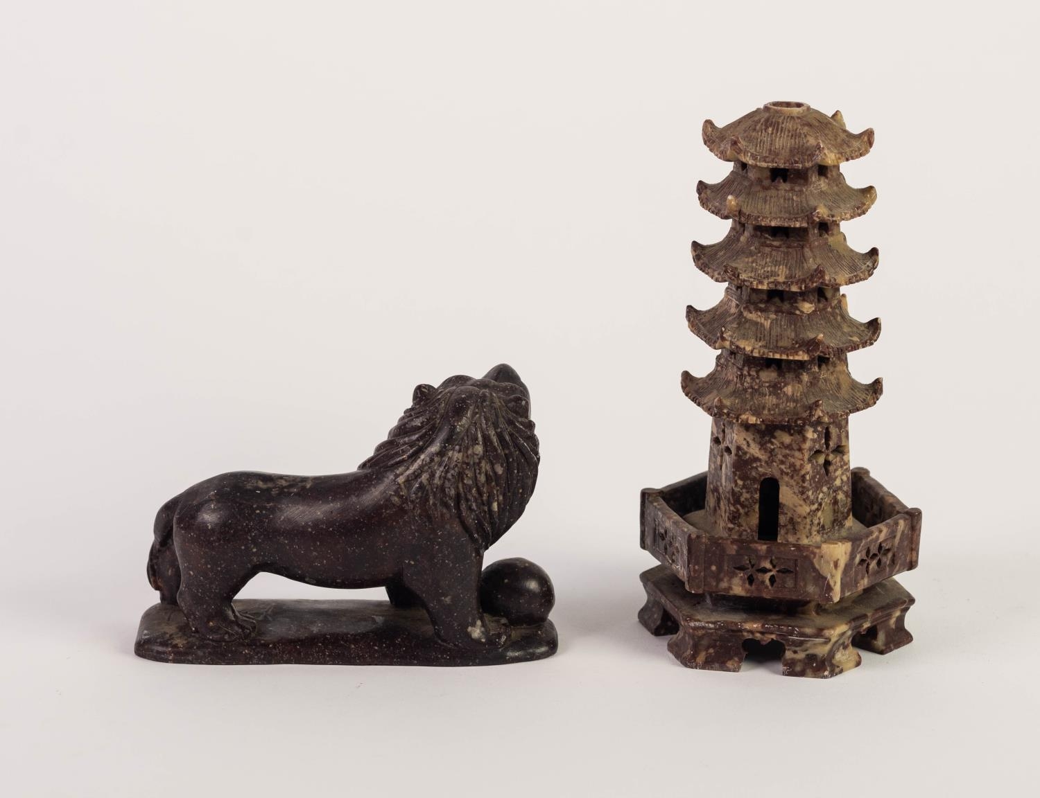 CHINESE CARVED DARK RED SOAPSTONE MODEL OF A TEMPLE DOG, Modelled with brocade ball at its feet, - Image 2 of 2
