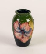 WALTER MOORCROFT HIBISCUS PATTERN TUBE LINED POTTERY SMALL VASE, painted in colours of pink, blue,