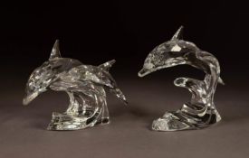 TWO SWAROVSKI GLASS MODELS OF LEAPING DOLPHINS, one singular, 3 ½? (8.8cm) high, the other with two,