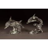 TWO SWAROVSKI GLASS MODELS OF LEAPING DOLPHINS, one singular, 3 ½? (8.8cm) high, the other with two,