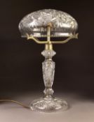 EARLY TWENTIETH CENTURY CUT GLASS TABLE LAMP, the base with slender column, domed foot and