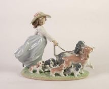 LLADRO PORCELAIN GROUP, modelled as a young girl with two dogs on leads and five puppies, (6784),