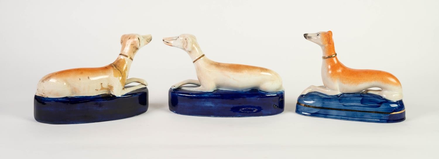 THREE VICTORIAN STAFFORDSHIRE POTTERY RECUMBENT GREYHOUND MANTEL SHELF SPILL RECEIVERS, (one damaged - Image 2 of 2