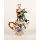 JULIA KIRILLOVA FIGURAL CERAMIC TEAPOT, modelled with a seated saxophone player to the cover, the