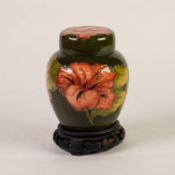 WALTER MOORCROFT HIBISCUS PATTERN TUBE LINED POTTERY GINGER JAR AND COVER, painted in tones od peach