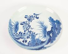EARLY 20th CENTURY JAPANESE PORCELAIN SHALLOW DISHED WALL PLAQUE, painted in underglaze blue with