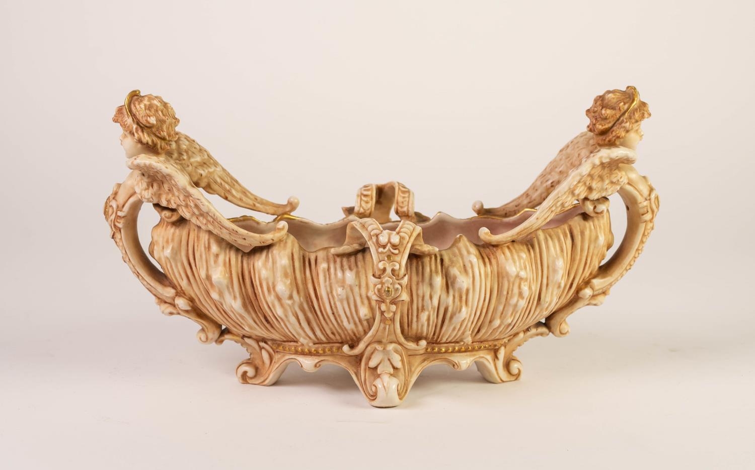 CIRCA 1900 AUSTRIAN PORCELAIN ELLIPTICAL BOAT SHAPE BOWL, the body of shell moulded form rising from