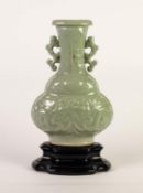 CHINESE QING DYNASTY CELADON GLAZED MOULDED POTTERY IN THE ARCHAIC TASTE, of flattened baluster form